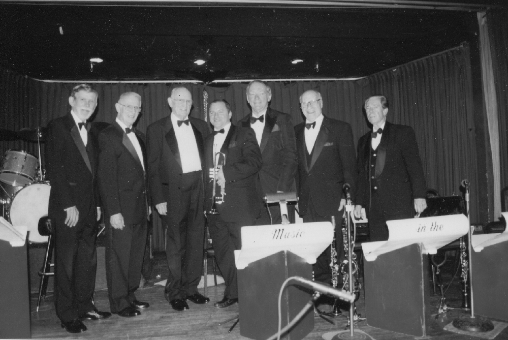 BROTHERS WHO PLAY TOGETHER STAY TOGETHER — Brothers Don and Slim performed together at the Mayflower Ballroom for 23 years until its closure in 2003. The Tanner Brothers Orchestra, pictured in March 2006 (left to right): Byron Long (piano), Slim Tanner (bass), Don Tanner (drums), Mike McGuffey (trumpet), John Bambridge (sax), Johnny Rotella (sax), and Bob Efford (sax). (Photo courtesy Slim Tanner)